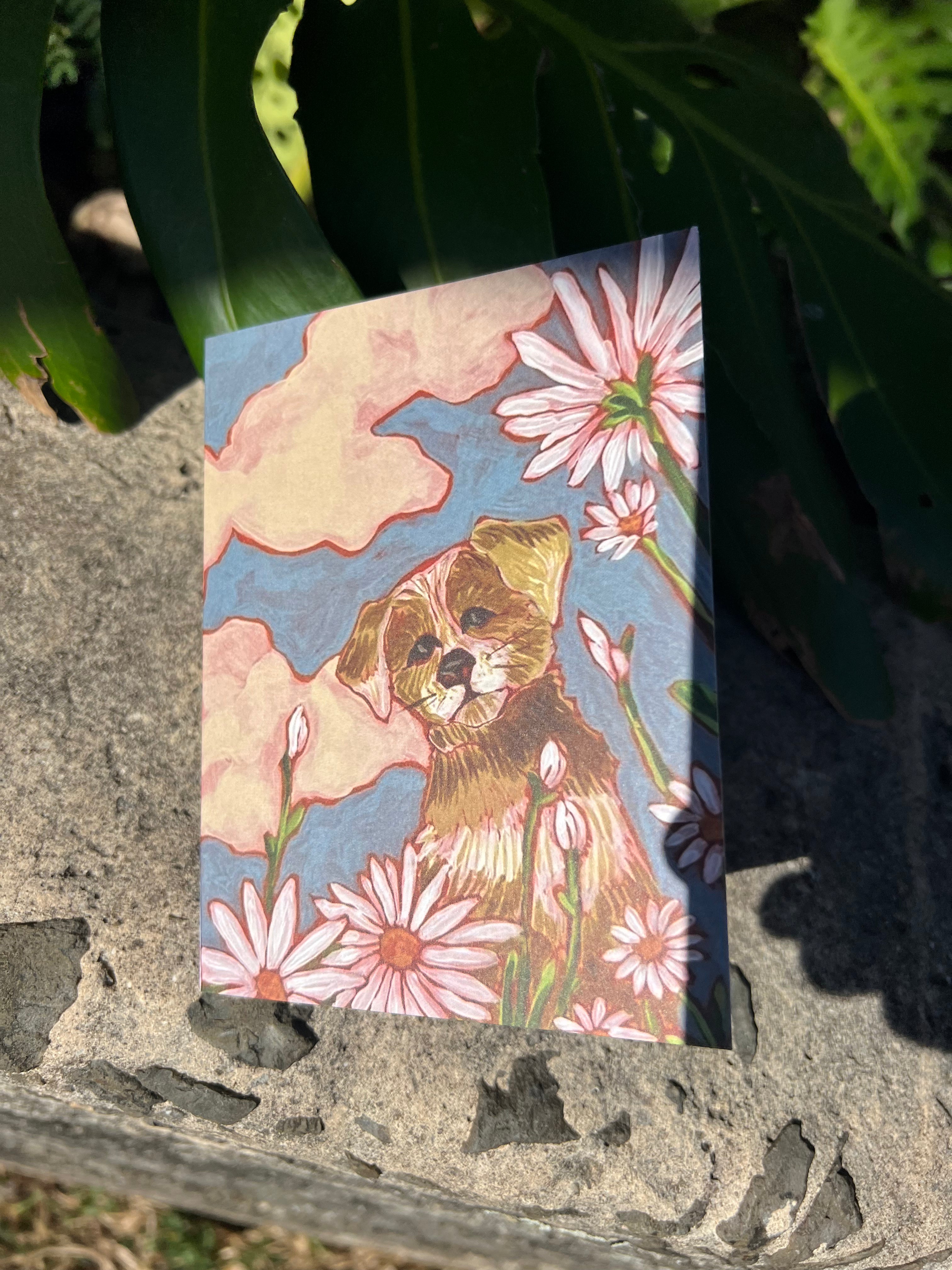 Greeting card with a puppy and some flowers. 