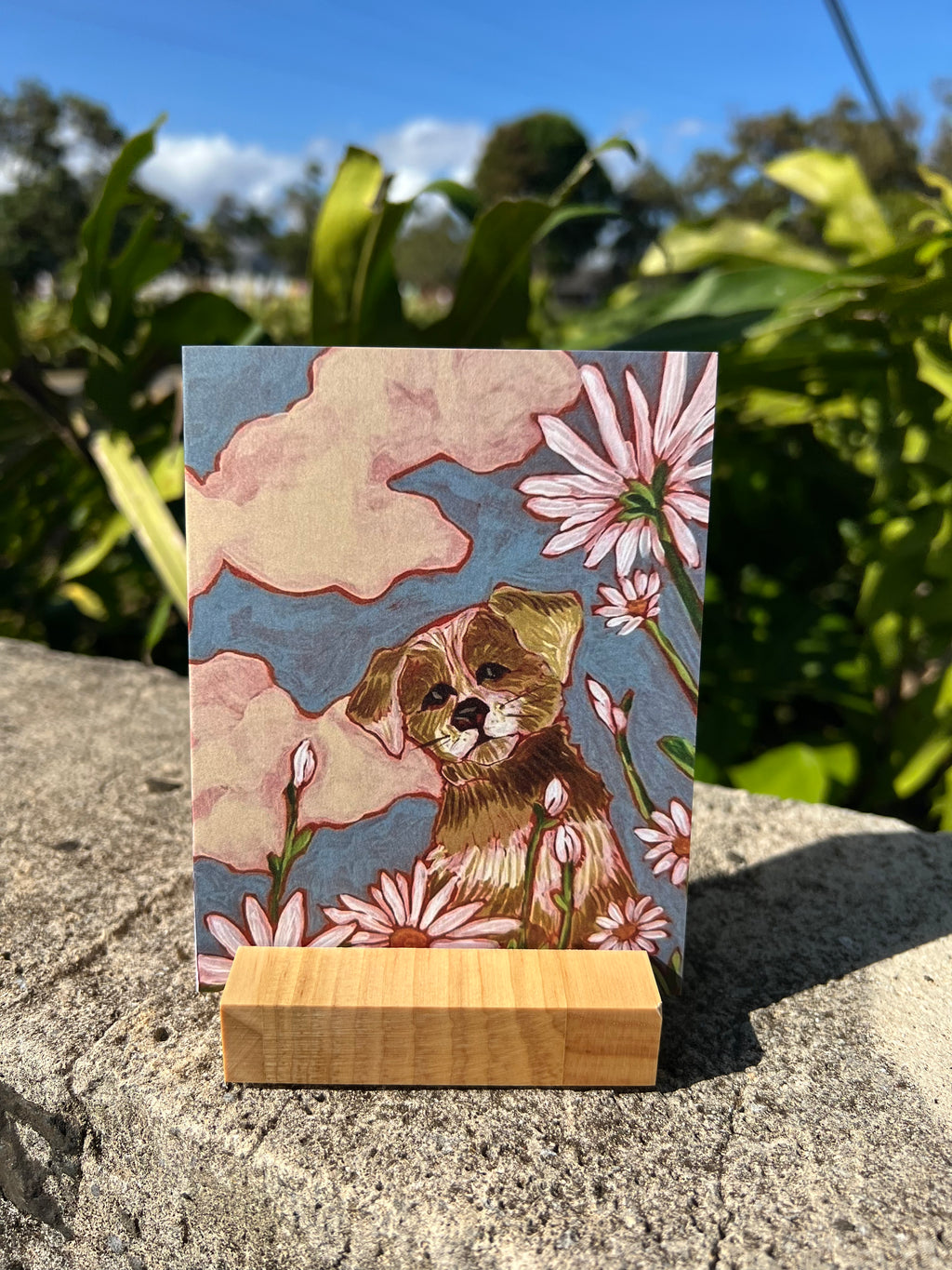 Greeding card with a dog and some flowers. 