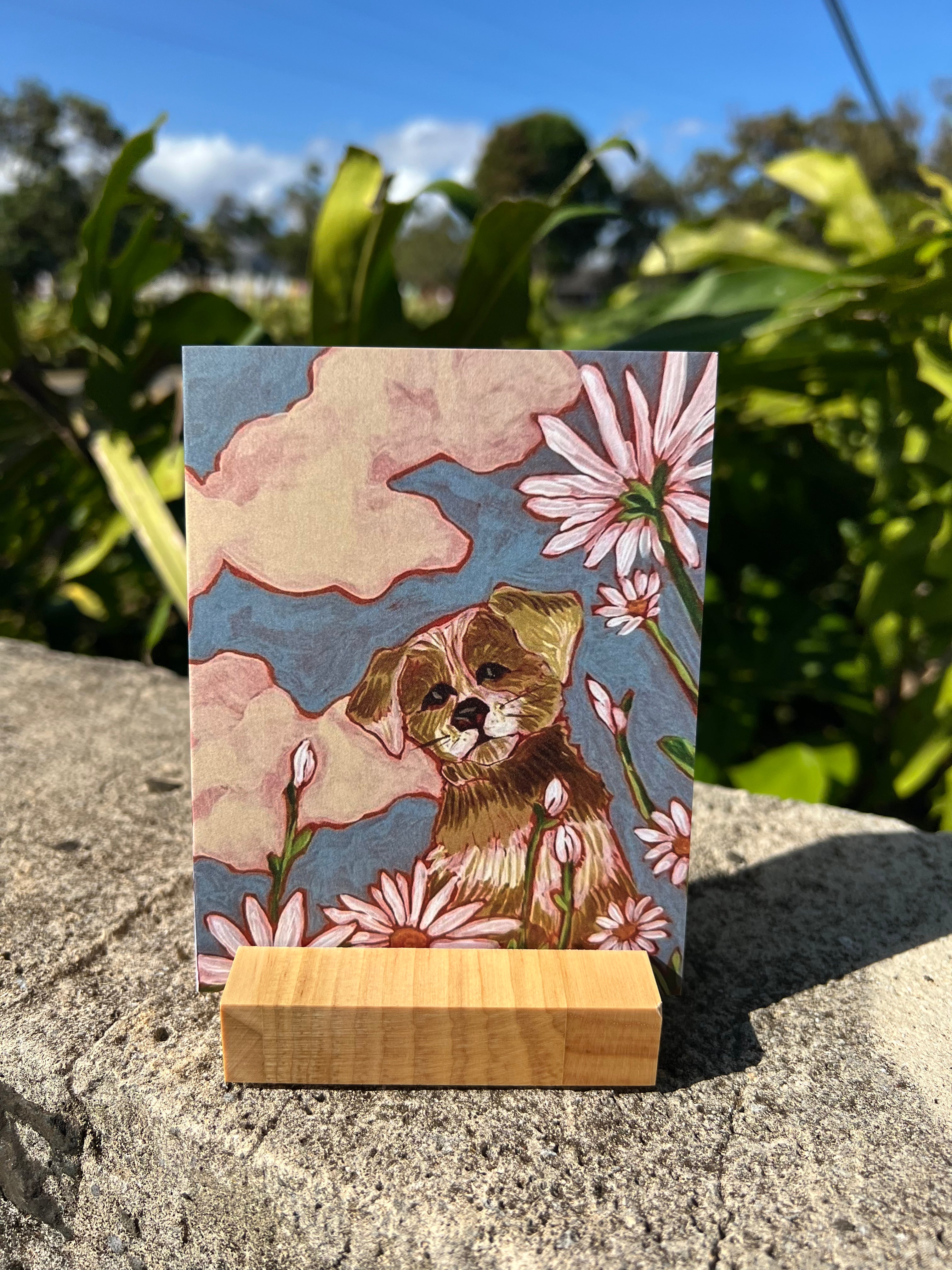 Greeding card with a dog and some flowers. 